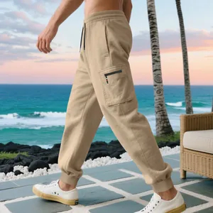 Detailed side profile of khaki cargo sweatpants showing pocket and elastic cuffs