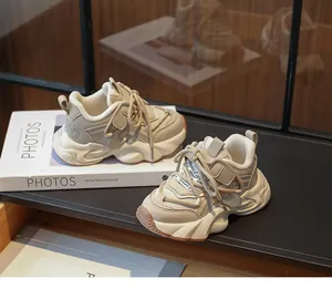 Detailed side view of stylish beige chunky sneakers for girls with plush lining