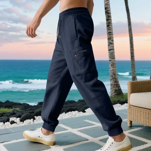 Detailed close-up view of navy blue cargo joggers with side zip pocket and drawstring waist
