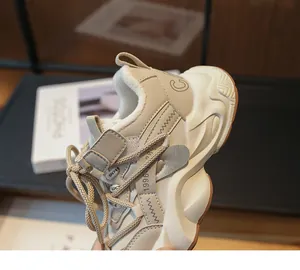 Close-up detail of cream chunky dad sneakers for girls featuring a thick anti-slip sole