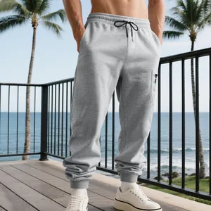 Detail of men's grey heavy joggers featuring cargo pocket and ribbed ankle cuffs.