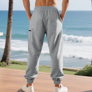 Back view of men's grey heavy cargo jogger pants with elastic waist and cuffs
