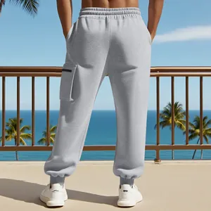 Back view of heavy grey cargo sweatpants featuring a side zipper pocket and cuffed hems