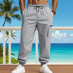 Detail view of men's grey heavy joggers with cargo pocket and drawstring waist