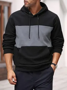 Close-up detail of men's color-block polar fleece hoodie in black and gray colorway