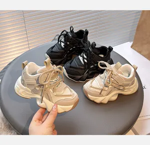 Stylish and breathable children's chunky dad sneakers for girls in black and beige colors.