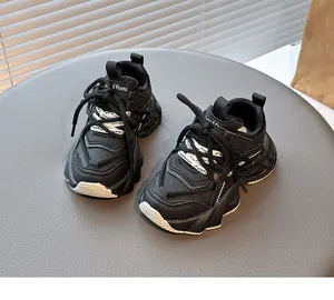 Close-up view of black breathable mesh chunky sneakers for girls in a stylish setting
