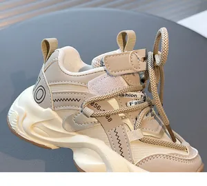 Close-up detail of beige girls' breathable mesh dad sneakers with stylish accents
