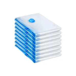 Pile de sacs de rangement sous vide transparents et bleus pour vêtements et literie