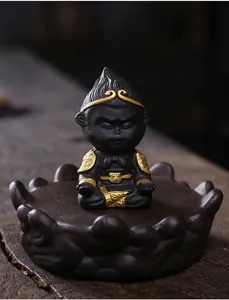 Detailed macro view of black purple sand Sun Wukong figurine with ornate gold armor details
