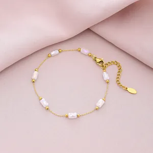Detailed view of a gold-plated stainless steel bracelet with six faceted crystal beads.