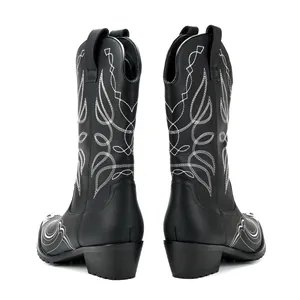 Detailed rear view of black western cowboy boots featuring intricate white vintage embroidery
