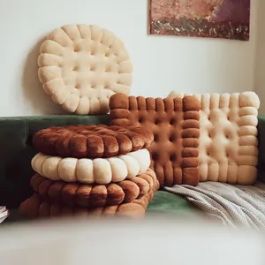 Close-up of cute biscuit-shaped plush floor cushions in round and square designs.