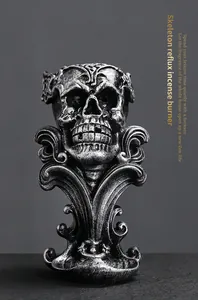 Close-up of gothic skeleton reflux incense burner with vintage silver finish texture