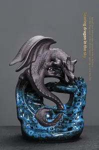 Detailed macro view of matte dragon texture and blue kiln-change glaze on backflow incense burner
