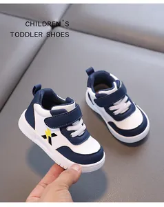 Close-up of blue and white waterproof toddler walking shoes with soft non-slip sole