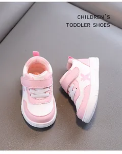 Pink and white toddler walking shoes with waterproof leather and non-slip soft sole