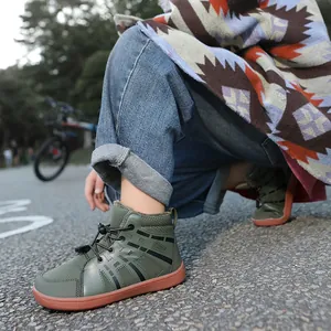 Warm fleece-lined kids winter boots with durable rubber soles shown in outdoor setting