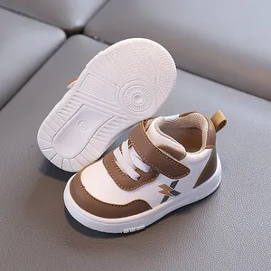 Brown and white baby walking shoes with waterproof leather and non-slip soft soles