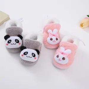 Detail view showing warm fleece-lined baby walking shoes with cute panda and rabbit designs
