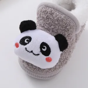 Close-up macro view of a plush panda baby walking shoe with warm white fleece lining