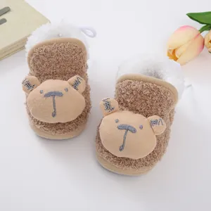 Adorable brown plush winter baby booties with bear design and warm faux fur lining.