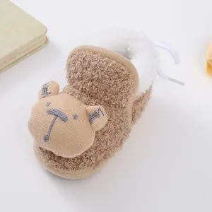 Close-up of thick fleece-lined baby winter bootie featuring cute bear embroidery