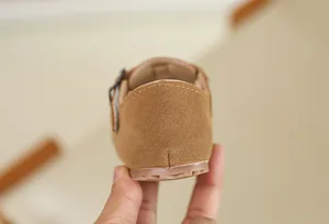 Detailed back view of brown suede children's Birkenstock-style leisure shoes.