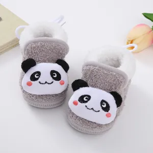 Close-up detail of the cute embroidered panda design on thick plush winter baby walking shoes