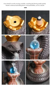 Close-up of cobra backflow incense burner with smoke flowing over blue glass ball