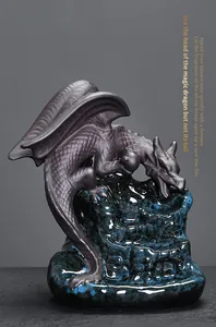 Close-up of ceramic dragon backflow incense burner with blue glazed base