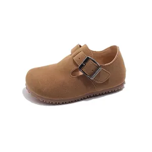 Brown children's T-strap suede shoes with adjustable metal buckle and non-slip sole
