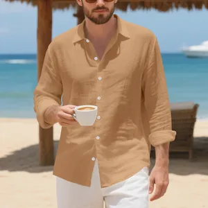 Detailed view of a tan linen long sleeve shirt worn by a male model on a sunny beach