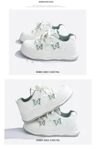 Close-up of white sneakers with green butterfly accents and thick platform soles