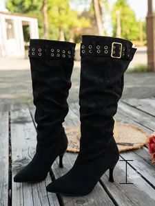 Detailed view of suede pleated knee-high boots showing 7.5cm stiletto heel height