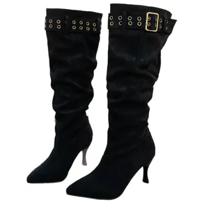 Stylish slouchy black suede knee-high boots featuring stiletto heels and gold buckle accents