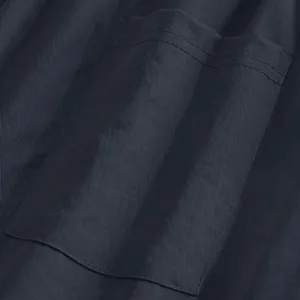 Close-up of navy blue cargo pants pocket with durable stitching and fine fabric texture