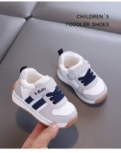 Detailed view of grey and white breathable toddler shoes with velcro strap and soft sole