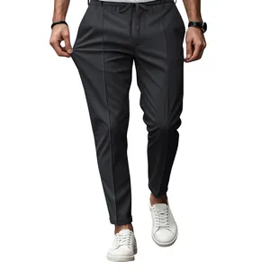 Detail view of men's slim fit stretch dress pants with adjustable drawstring waist.