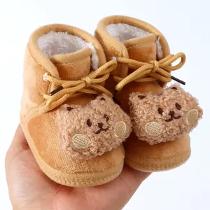 Warm brown plush baby boots with cute teddy bear design and soft fleece lining