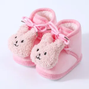 Cozy pink baby fleece boots with cute plush bunny decor for winter warmth.