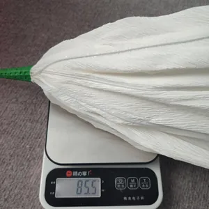 Digital scale showing the 85.5g weight of a large white crinkle paper poppy flower