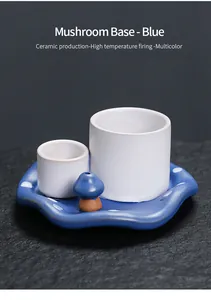 Detailed view of the blue mushroom ceramic base and white cups for incense burning set