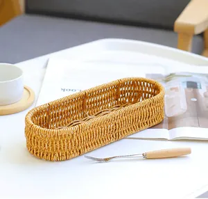 Handwoven imitation rattan cutlery basket for kitchen and tabletop organization.