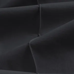 Macro view showing the fine fabric texture and stitching of men's casual trousers.