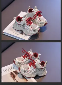 Close-up of stylish girls' breathable beige and maroon mesh sports sneakers for autumn