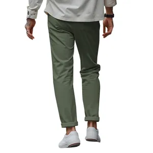 Back view of men's slim fit olive green chinos trousers paired with white sneakers detail