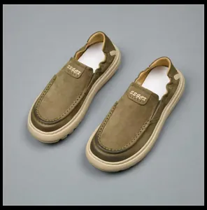 Overhead view of olive green men's slip-on loafers with durable soft rubber soles