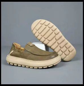 Detailed view of olive green loafers with beige lug sole and SS logo