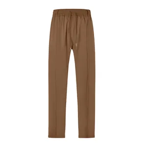 Detail view of men's brown drawstring casual trousers with pleated seam design
